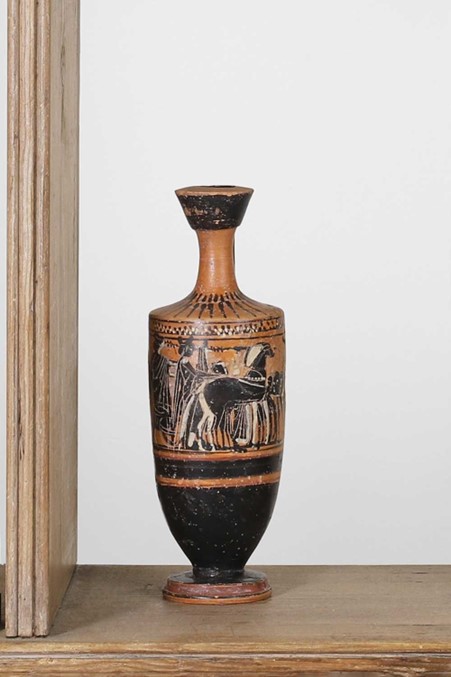 early 5th century BC, Greek, decorated with figures in a chariot and horses,
6.5cm wide
20cm high