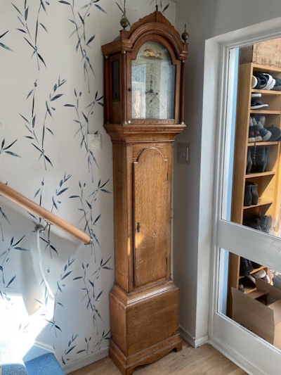 Longcase clock had its original finish removed and then polyurethane. 